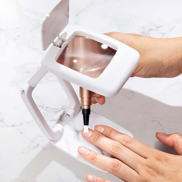 Precision magnifier and hand showing its used