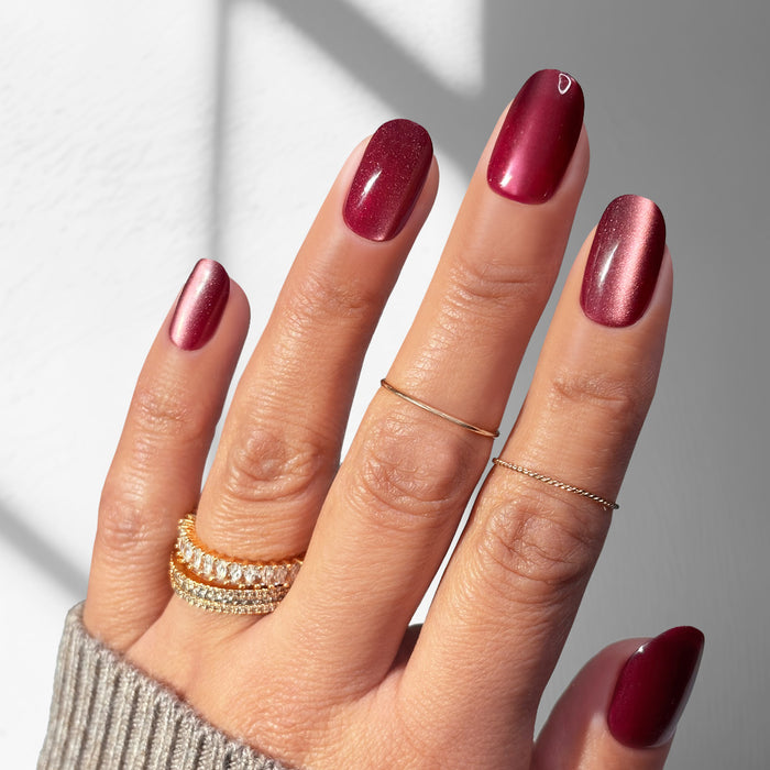 Crimson Romance press-on nails on finished hands
