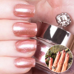 Nails showing blush pink shade with metallic effect
