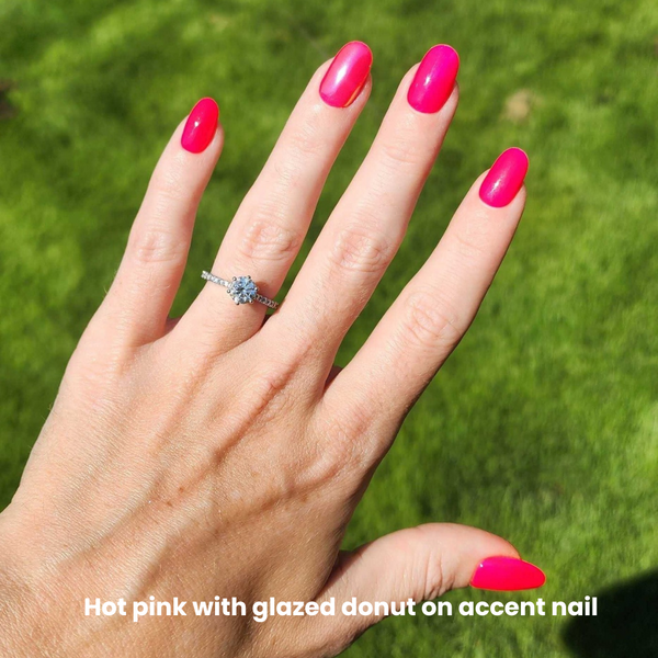 hand showing hot pink shade with glazed sustainable nails