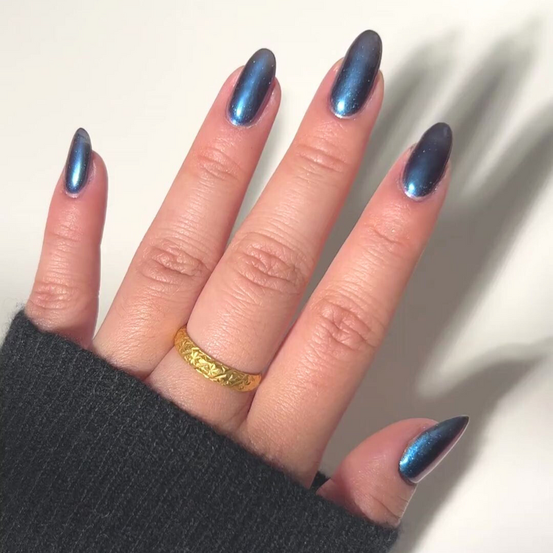 Nails showing rich blue  shade with metallic look