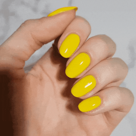Gid image of hand showing Lemon color on nails