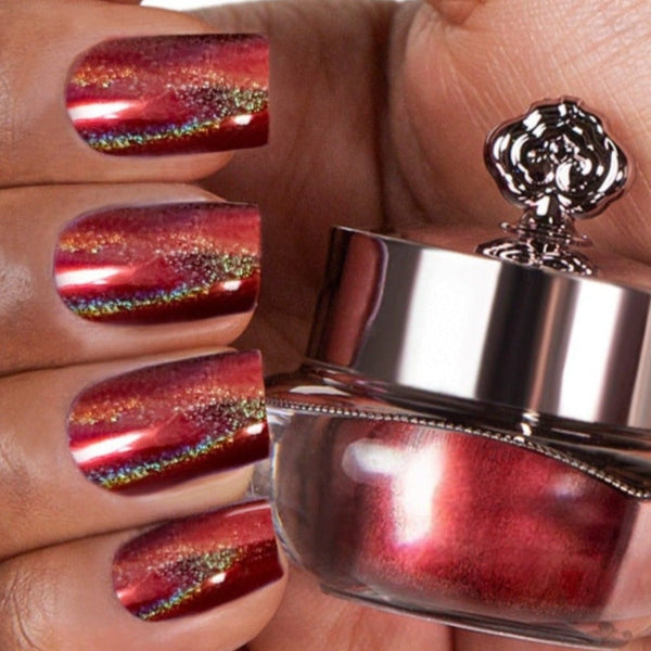 Nails showing rich red shade with holographic shine
