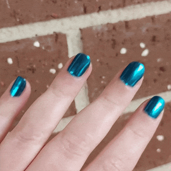Nails showing aqua green shade with metallic look