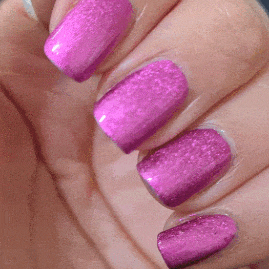 Nails showing hot pink shade with metallic effect